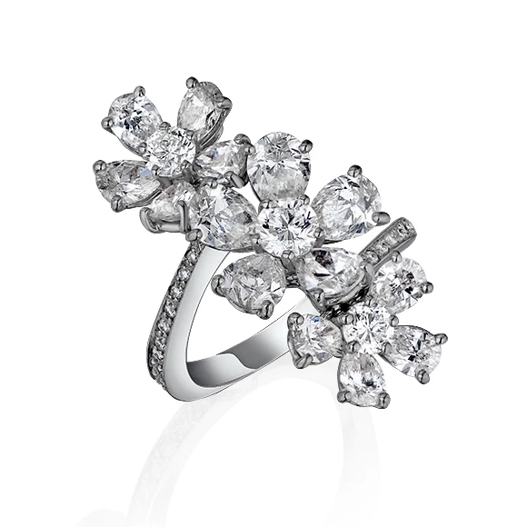 TRIPLE FLOWER RING SET ON A WHITE ROUND PAVE BAND