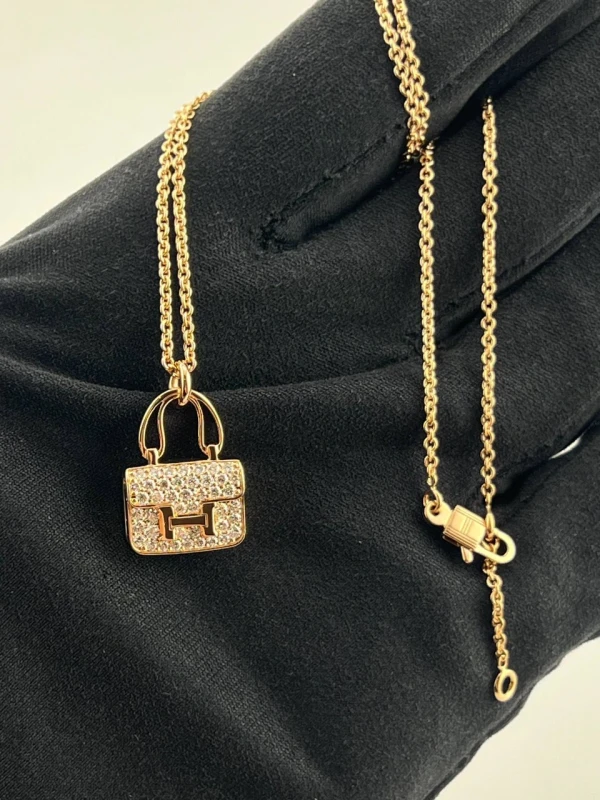 HERMES CONSTANCE AMULETTE PENDANT, SMALL MODEL Hermes 3