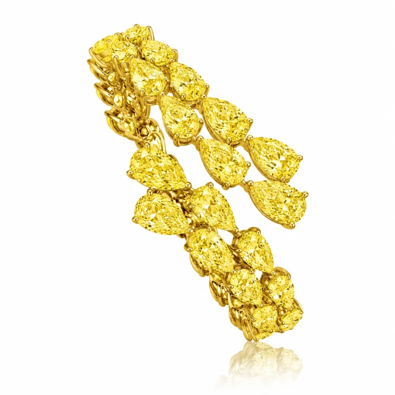 PEAR DIAMONDS 34.03 CT FANCY LIGHT YELLOW BRACELET (SIZE 17)